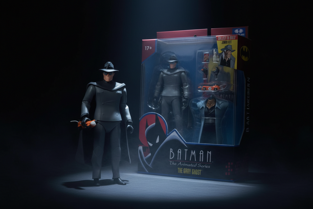 McFarlane Gray Ghost figure next to Batman The Animated Series packaging box under dramatic spotlight
